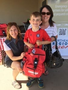 Fort Saskatchewan seven-year-old Tyson Broad and his mother Crystal pick up an emergency preparedness kit from Northeast Region Community Awareness Emergency Response (NRCARE) during Fort Saskatchewan's Emergency Preparedness Week event at Co-op on Tuesday, May 3.