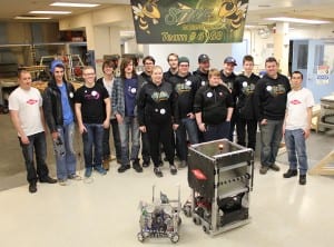 Jesse Hatley (far left) and Jerome Wong (far right) are two of many Dow Chemical employees who volunteer their time to mentor high school FIRST Robotics teams in Fort Saskatchewan. Featured here is the Sting team from Fort Saskatchewan High School.